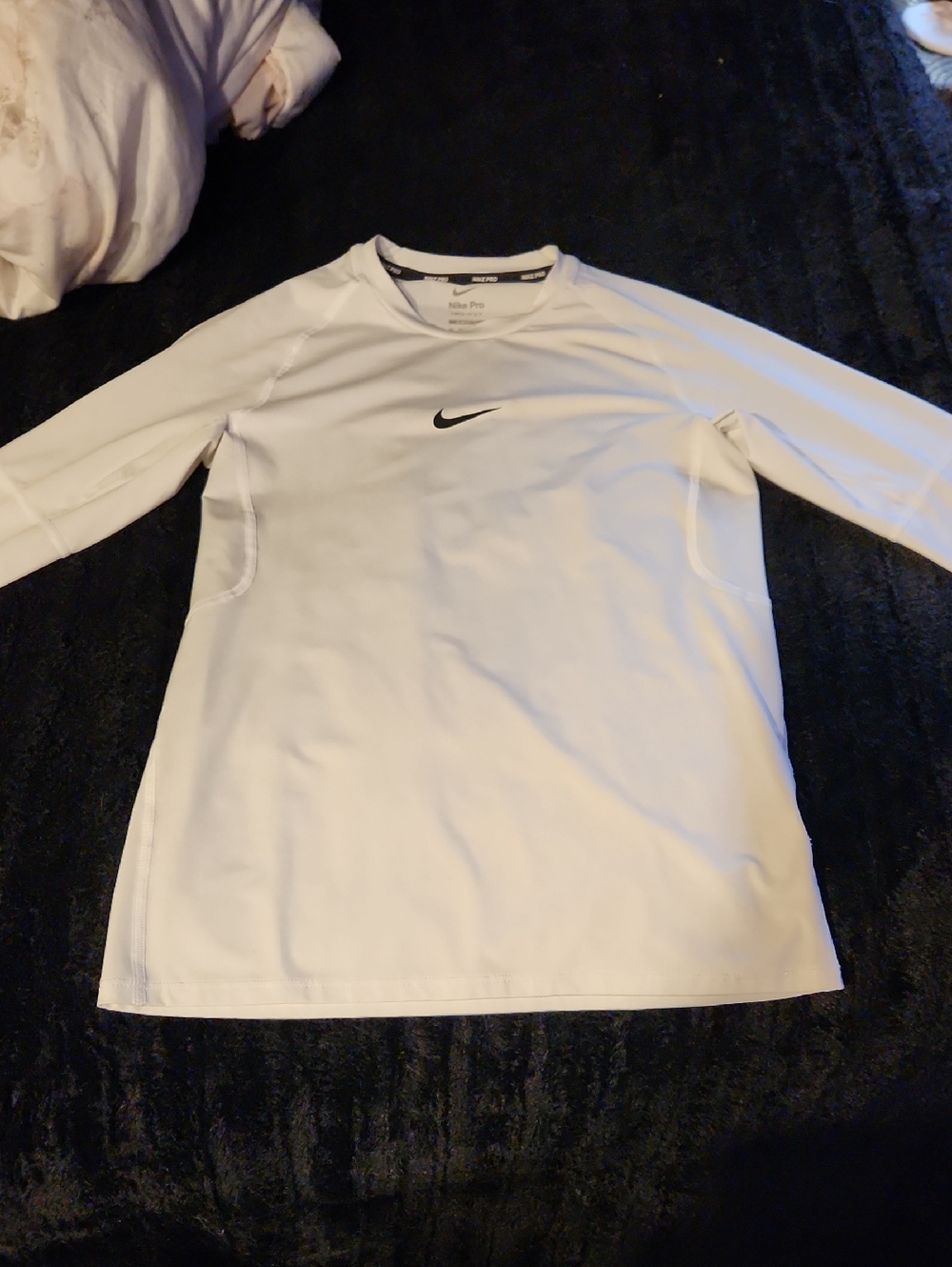 Nike White Long Sleeve Athletic Top with Black Swoosh
